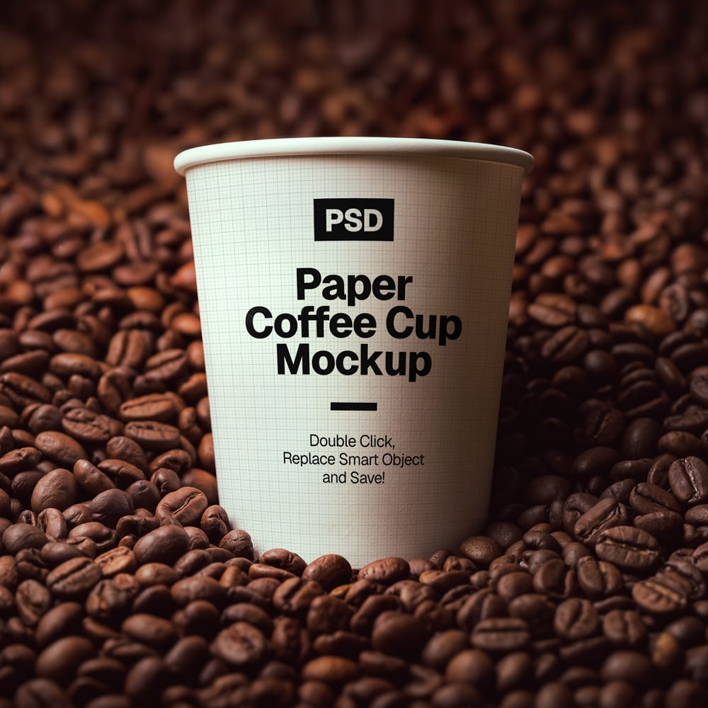 Free Paper Coffee Cup Mockup on Roasted Coffee Beans PSD