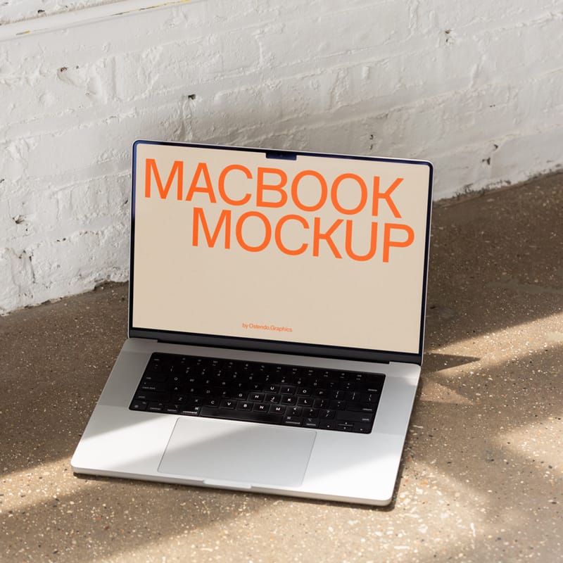 Macbook Pro Mockup on Concrete Studio Floor PSD
